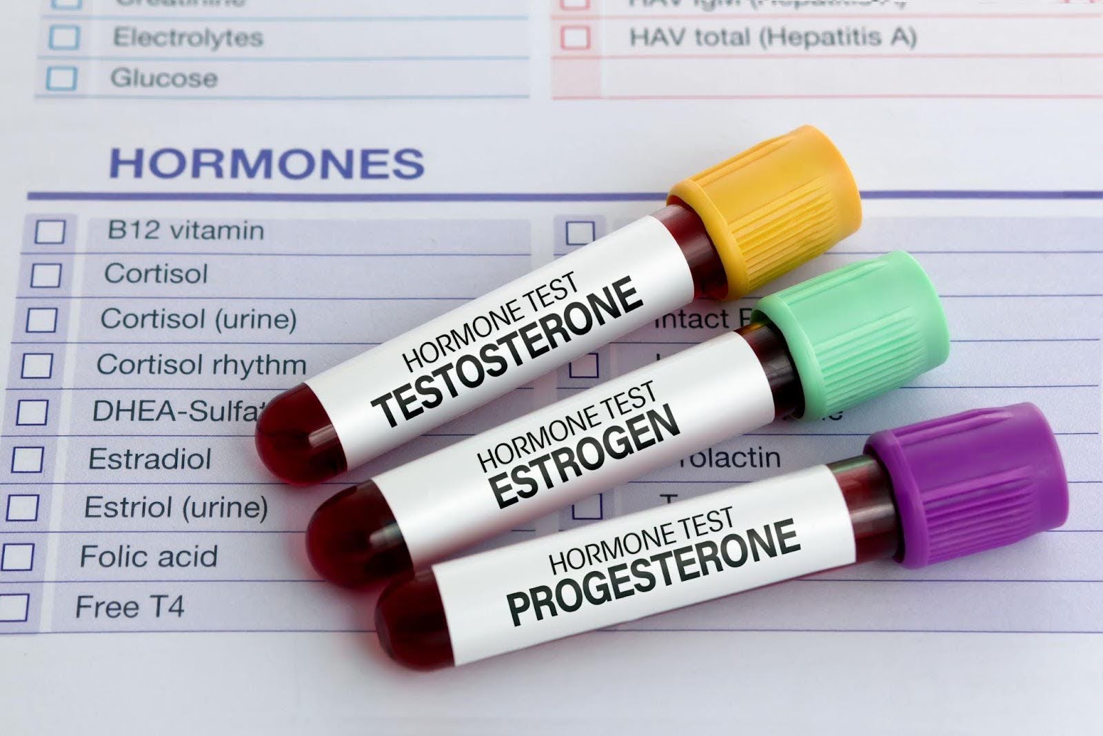 Medical chart displaying hormones and test strips for monitoring health conditions